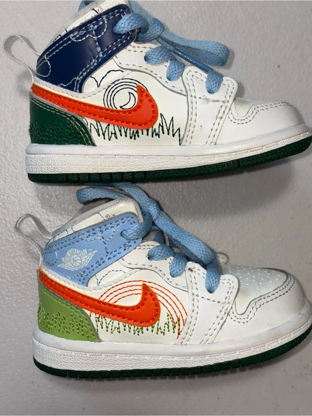Jordan Kids White, Orange & Green High-Top Sneaker with Light Blue Accents
